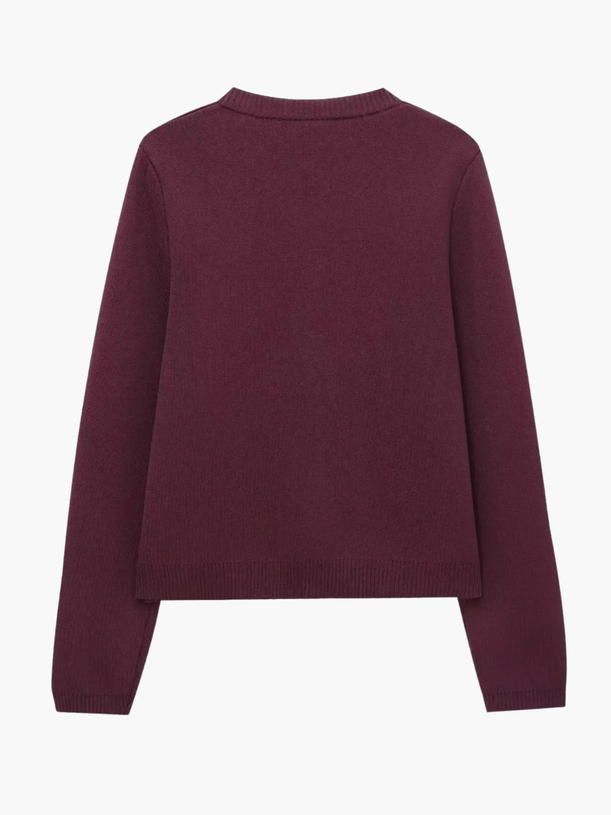 Elegancki sweter z ozdobnymi guzikami i kieszeniami