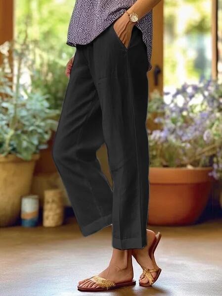 Eleganckie spodnie cropped z kontrastowym wykończeniem - Czarny