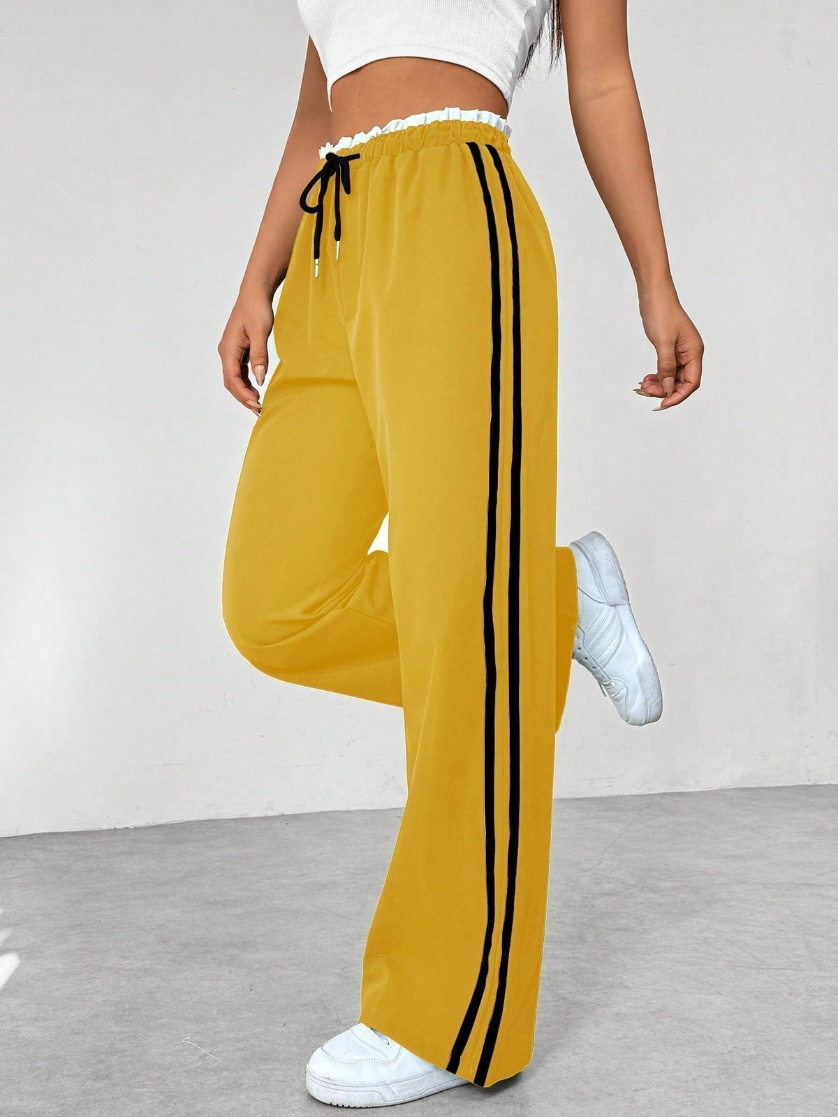Spodnie wide-leg z paskami po bokach - Żółty